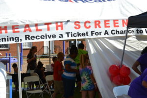 Health Screening Tent with people in it getting screening